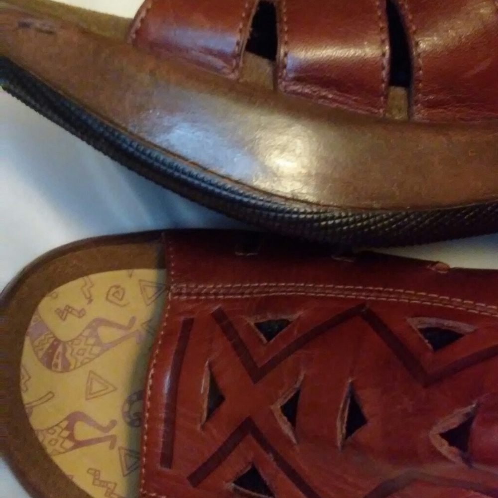 Pair of  leather Danski sandals with wooden heels